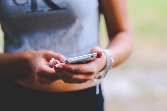 Chinese woman sending text